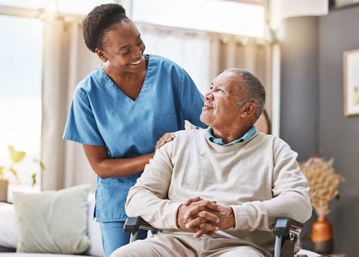 Senior Man talking to Female Nurse